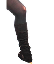 Load image into Gallery viewer, A close-up view of a person's leg wearing black opaque tights and matching black ribbed knit leg warmers, set against a plain background.