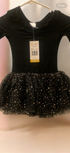 Load image into Gallery viewer, A black long-sleeved ballet dress featuring a sparkly, star-patterned tulle tutu skirt, displayed on a hanger.