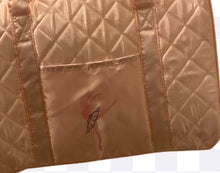 Load image into Gallery viewer, A detailed close-up of a light peach-colored quilted dance bag featuring an embroidered ballerina silhouette.