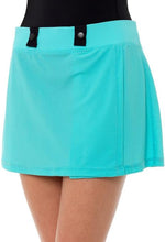Load image into Gallery viewer, A close-up view of a bright turquoise dance skirt featuring two black button details on the waistband, worn over a black leotard.